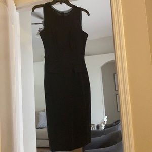 Black sleek pencil dress with front pockets